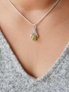 Raw Peridot 8-Shaped Pendant - raw carat