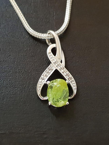 Raw Peridot 8-Shaped Pendant - raw carat