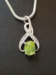 Raw Peridot 8-Shaped Pendant - raw carat